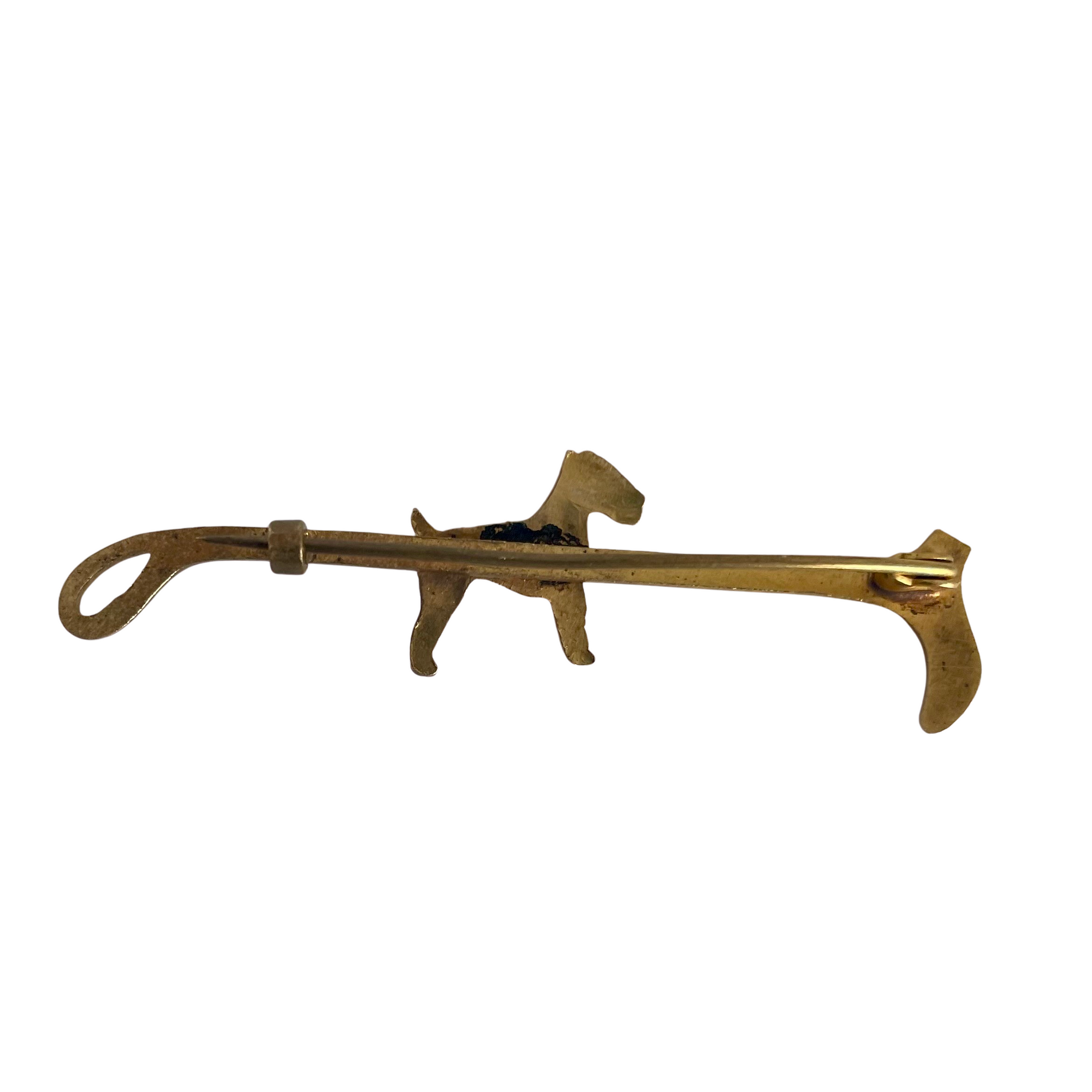 An Antique Terrier and Riding Crop Stock Pin