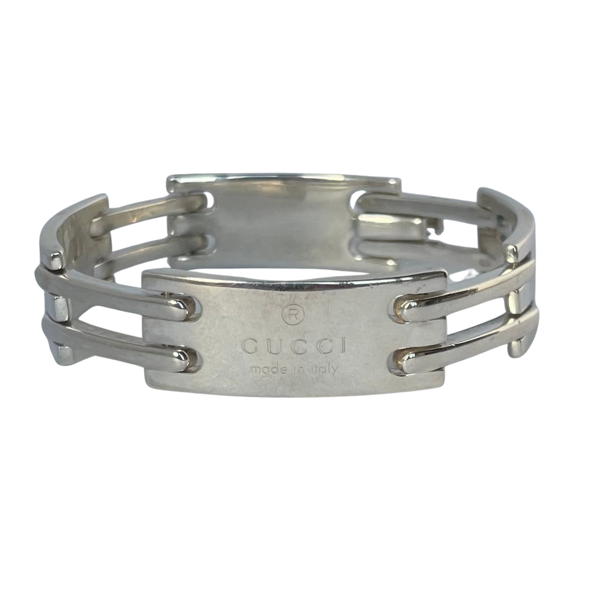 Vintage Gucci men's sterling silver gate-link ID plate bracelet with signature Gucci engraved central plate, white background