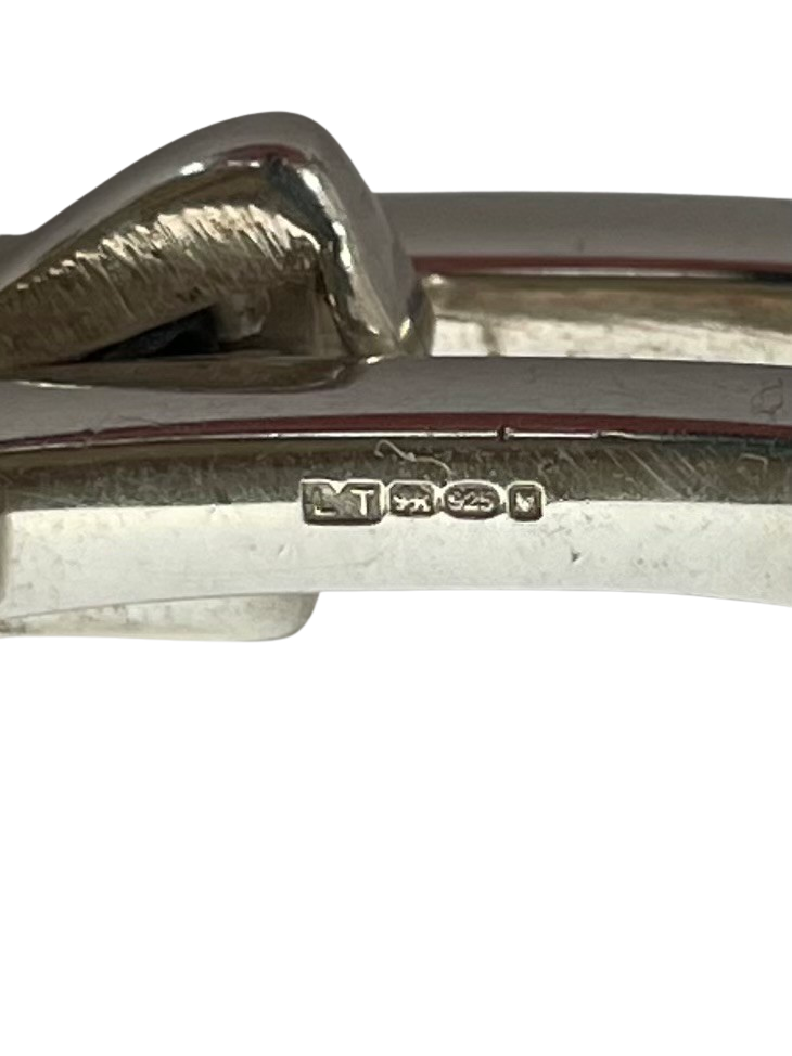 Vintage Gucci men's sterling silver gate-link ID plate bracelet with signature Gucci engraved central plate, white background, showing hallmark