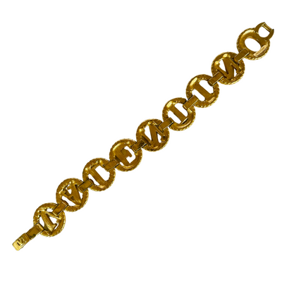 reverse side of gold tone Valentino chain link bracelet spelling Valentino