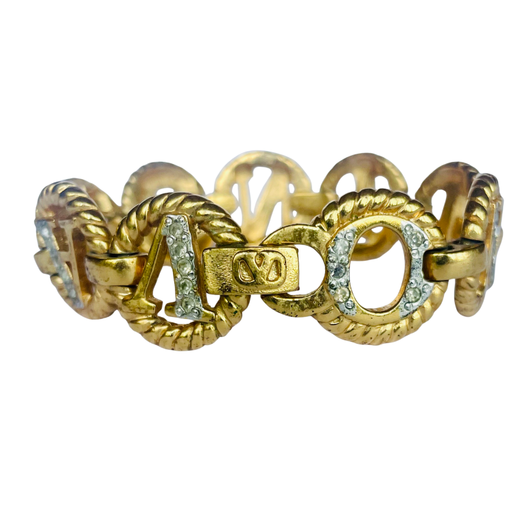 Gold tone Valentino chain link bracelet showing Valentino's 'v' logo signature