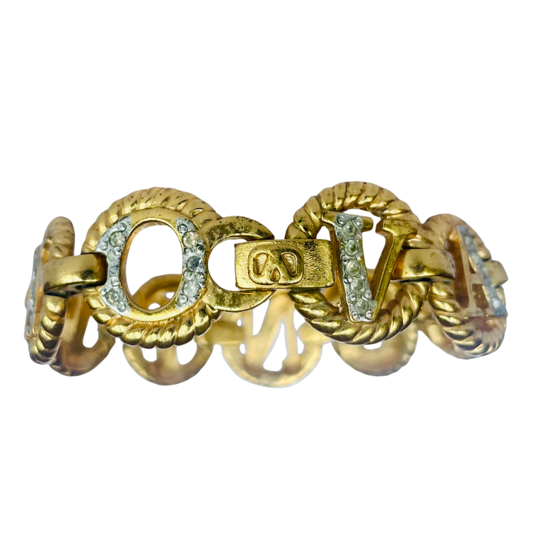 detail of Gold tone Valentino chain link bracelet spelling Valentino