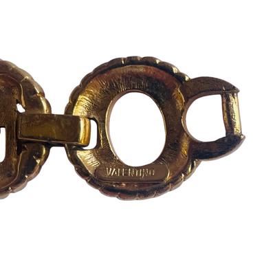 Gold tone Valentino chain link bracelet showing Valentino signature