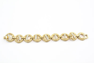 Gold tone Valentino chain link bracelet spelling Valentino