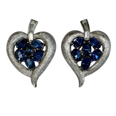 Vintage Crown Trifari cornflower blue oval crystal clip earrings in brushed silver Trifanium, signed, with clear baguette stones. Alfred Philippe era, 1960s.