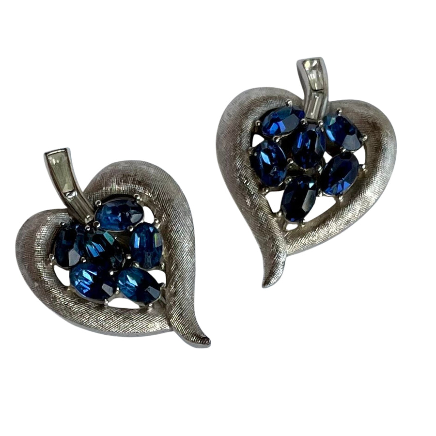 Vintage Crown Trifari cornflower blue oval crystal clip earrings in brushed silver Trifanium, signed, with clear baguette stones. Alfred Philippe era, 1960s.