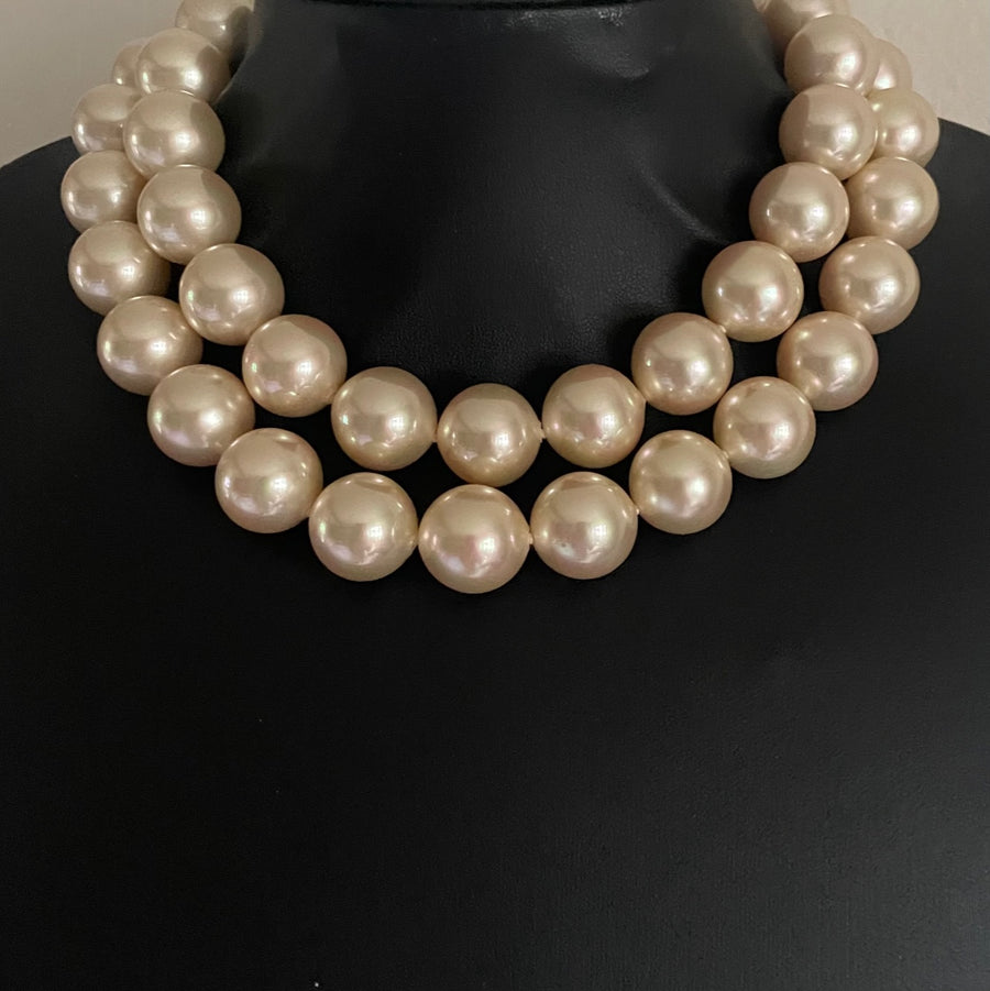 Pearl necklace on a black mannequin 15mm pearls, 32 inch length