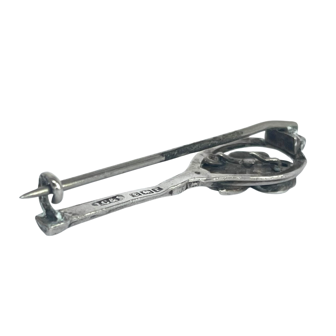 reverse if Antique 1916 sterling silver tennis racket brooch with Connemara green marble shamrock showing c clasp and pin