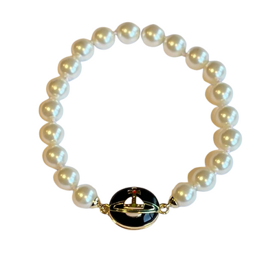 Vivienne Westwood Loelia pearl bracelet with a black and gold clasp on a white background