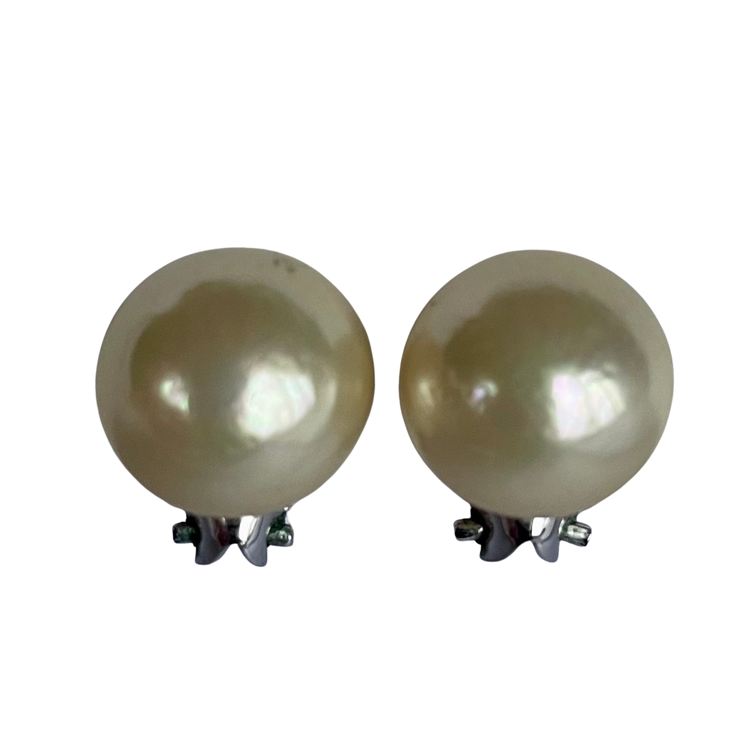 Pair of vintage Christian Dior button pearl earrings on a white background