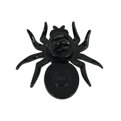 reverse side of early vintage Butler & Wilson black-coated metal mini spider pin with ruby red cabochon body, amber thorax crystal, and shimmering AB crystal legs. Showing B&W backstamp and butterfly closure.