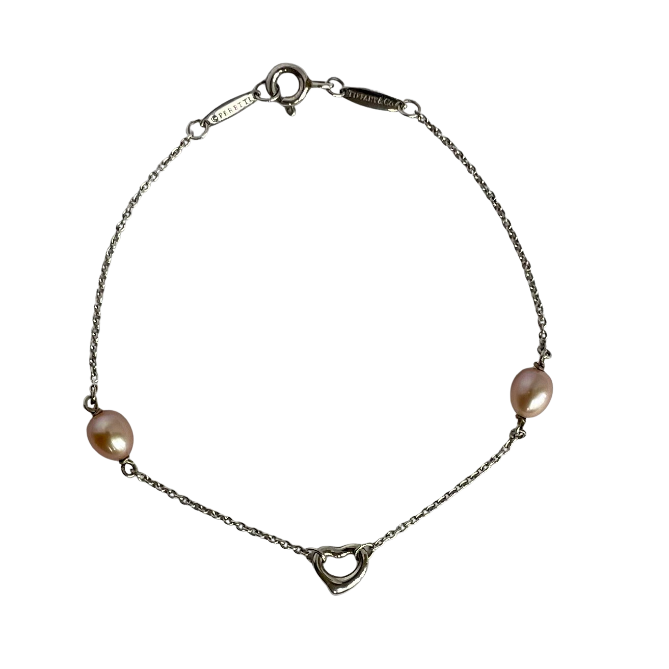 Tiffany & Co. Elsa Peretti Silver bracelet with pink pearls on a white background