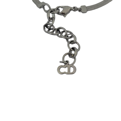 Christian Dior silver-tone bracelet with knotted bow detail and CD initial charms, John Galliano era Y2K showing extender chain with CD logo