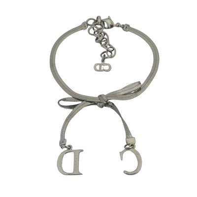 reverse of Christian Dior silver-tone bracelet with knotted bow detail and CD initial charms, John Galliano era Y2K