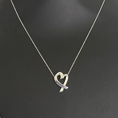 Paloma Picasso for Tiffany & Co Loving Heart silver pendant necklace displayed on jewellery bust