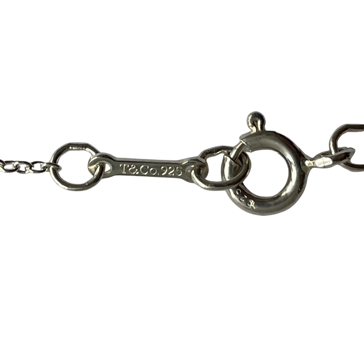 Close-up of Tiffany & Co necklace clasp stamped T&Co.925 sterling silver