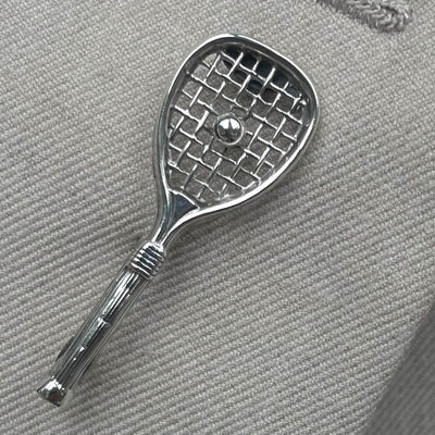 A vintage sterling silver tennis racquet brooch with Birmingham 1936 hallmarks
