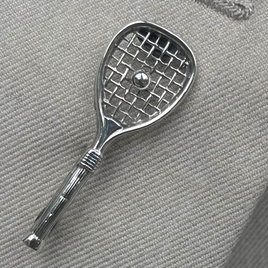 A vintage sterling silver tennis racquet brooch with Birmingham 1936 hallmarks
