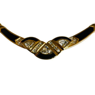Gold necklace with black accents and gemstones on a white background on a whitebackround