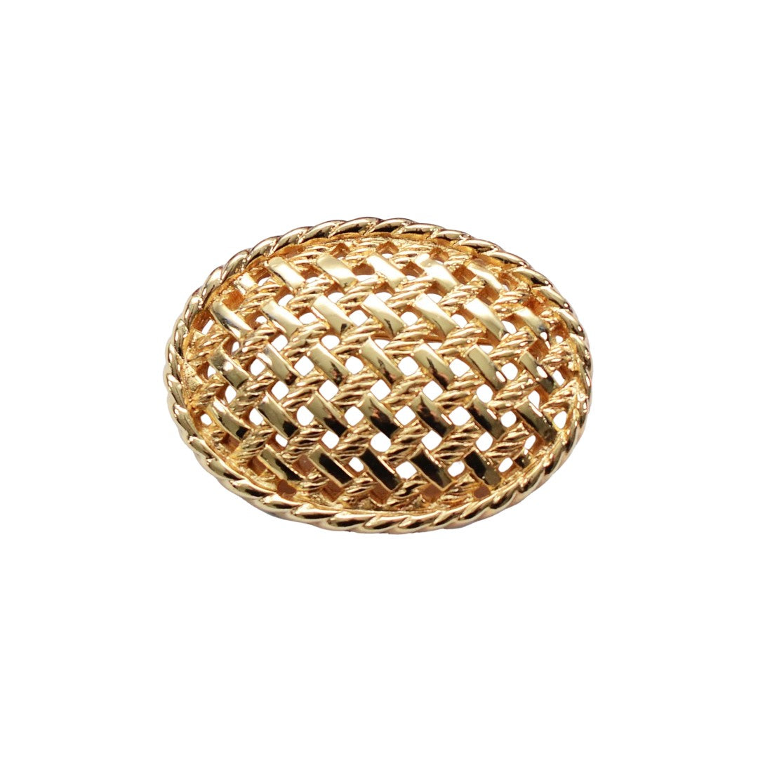 Dior gold plated basket weave brooch on white background