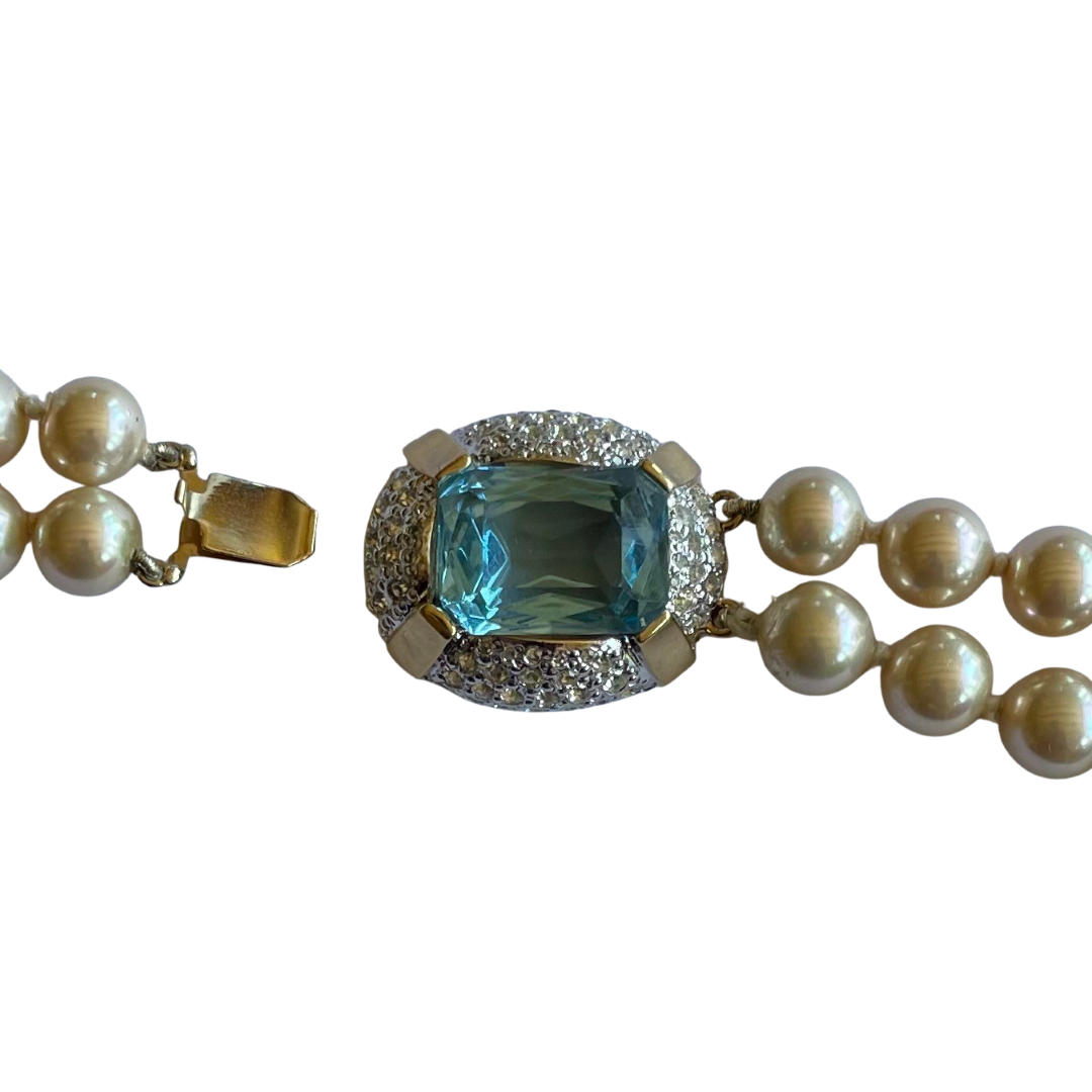 picture shows clasp mechanism on a Vintage Vogue Bijoux double-strand faux pearl necklace with 10mm cream pearls, crystal rondelle spacers and an aquamarine crystal pavé-set clasp, 1980s.