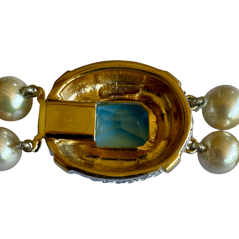 picture shows reverse of and backstamp on Vintage Vogue Bijoux double-strand faux pearl necklace with 10mm cream pearls, crystal rondelle spacers and an aquamarine crystal pavé-set clasp, 1980s.