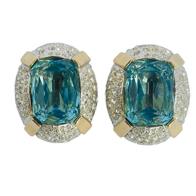 Pair of 1980s Vogue Bijoux gold-plated clip-on earrings, each set with a large cushion-cut aquamarine crystal surrounded by pavé clear crystals
