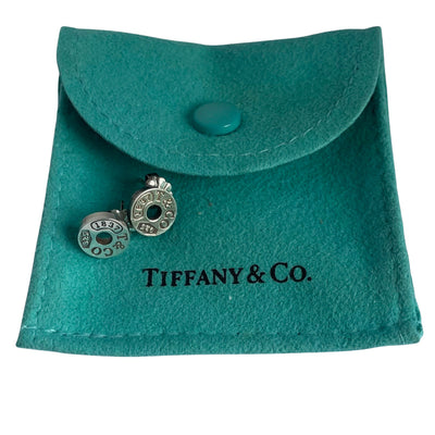 Tiffany & Co. Silver Circle 1837 earrings on  Tiffany & Co. blue pouch