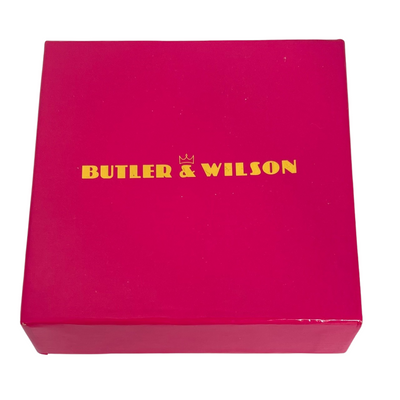Pink box for Butler & Wilson martini glass brooch set aurora borealis crystals with baguette cut crystals forming the stem and a baguette-cut crystal on the glass.