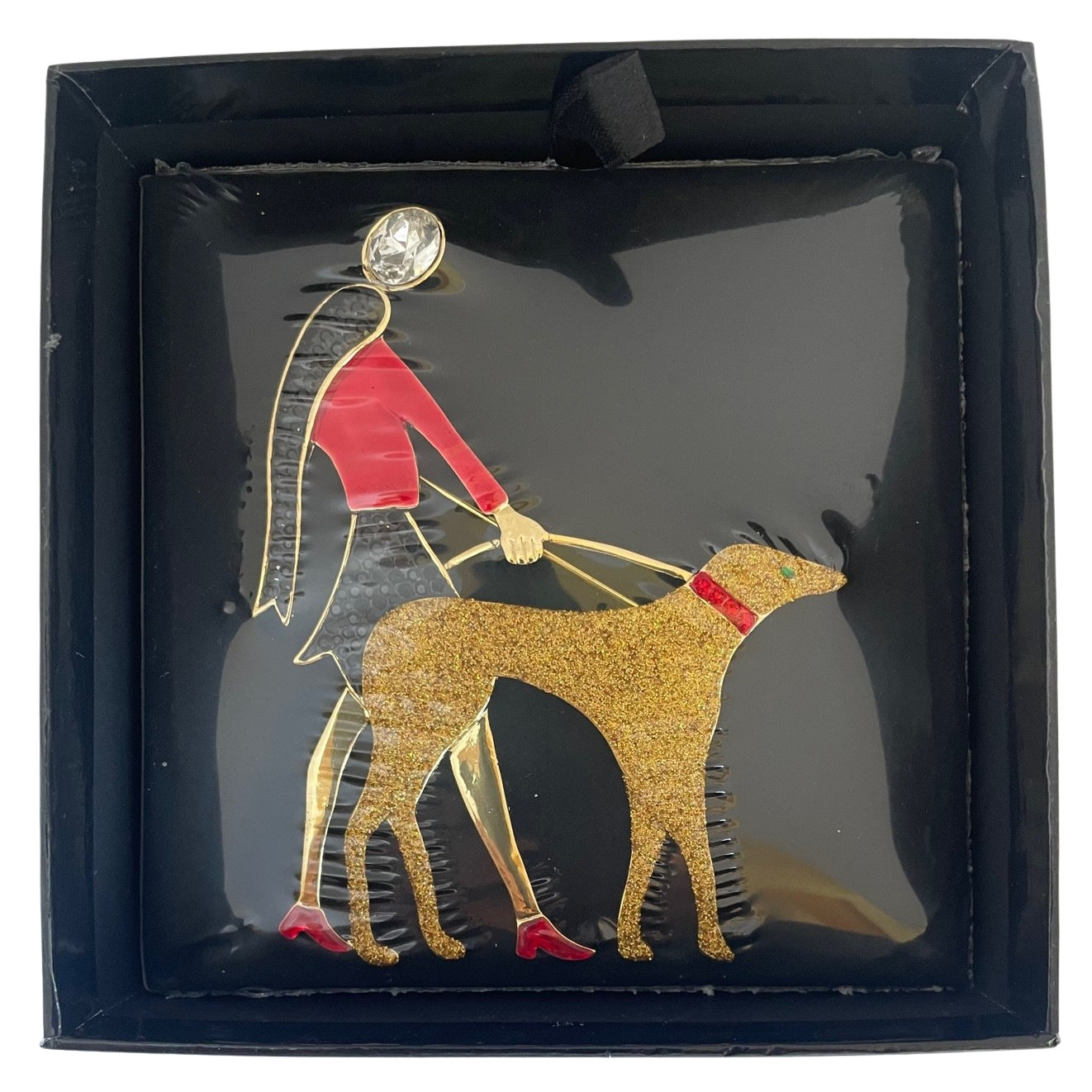 Butler and Wilson Art Deco brooch of a flapper lady in red enamel walking a gold glitter hound dog brand new and sealed in Butler & Wilson box.