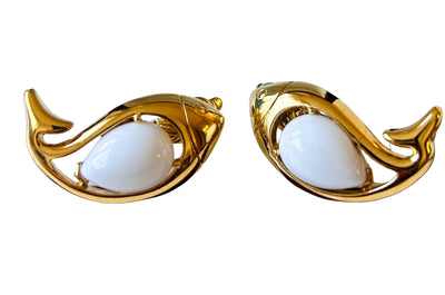 vintage 1980s Trifari TM gold-tone fish clip-on earrings featuring a teardrop white lucite jelly belly cabochon.