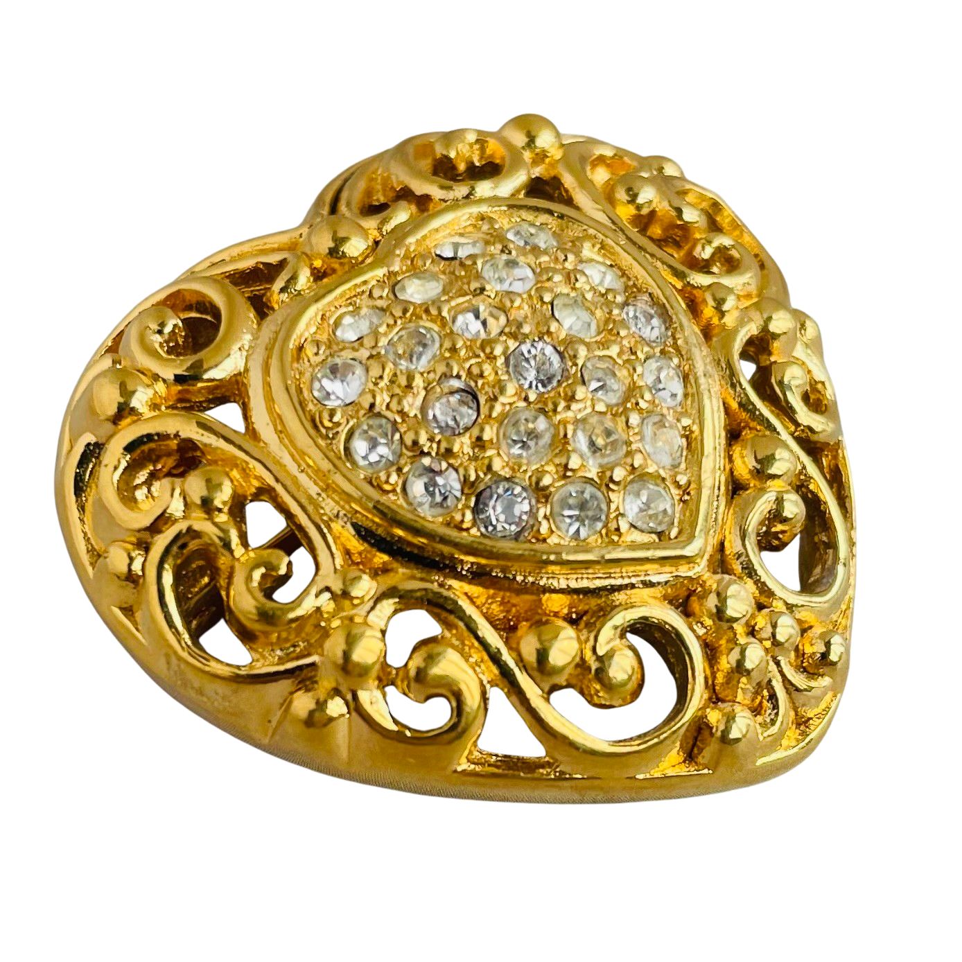 1980s Christian Dior gold-plated filigree heart brooch with a crystal-encrusted pavé centre heart, showing intricate baroque style scrollwork.