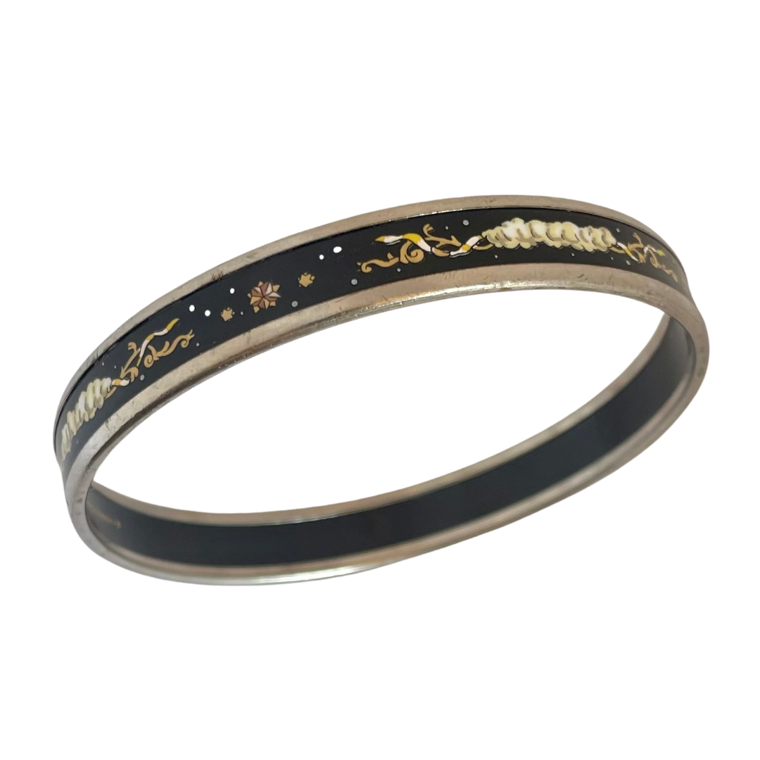 Vintage Hermès Paris enamel bangle, midnight black with multicolour celestial motif of clouds, stars and scrollwork, silver tone, made in Austria by Michaela Frey