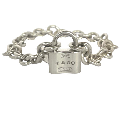 Vintage Tiffany & Co 1837 sterling slver padlock charm bracelet with heavy rolo links padlock on white background
