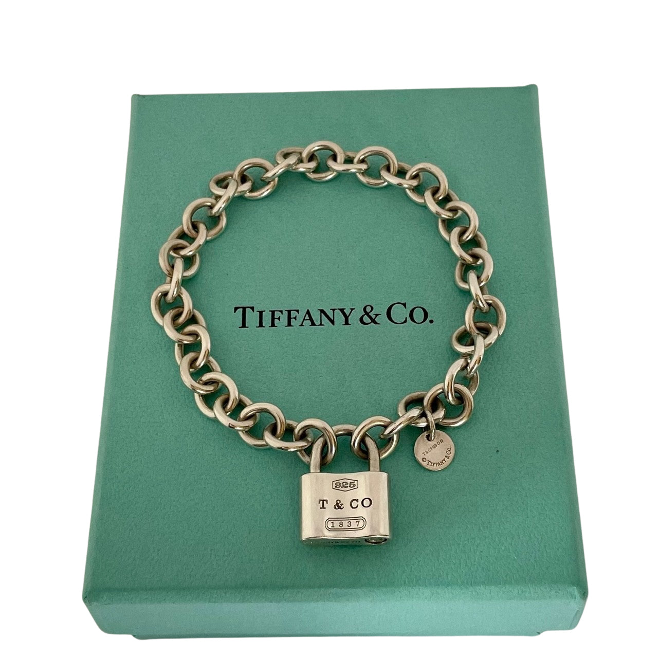 Vintage Tiffany & Co 1837 sterling slver padlock charm bracelet with heavy rolo links on Tiffany blue box.