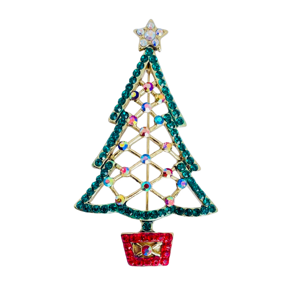 A Butler and Wilson open lattice Christmas tree brooch sett with sparkling green crystals and aurora borealis crystals topped with golden star set with aurora borealis crystals  in pavé set crystal stand.