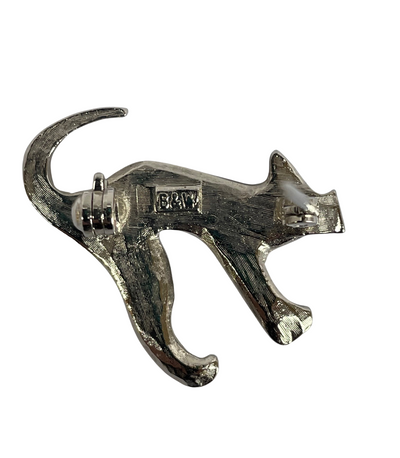 The textured silver-tone reverse side of the Butler & Wilson cat brooch, displaying the authentic stamped "B&W" makers mark inside a rectangular cartouche and a functional revolver safety clasp.
