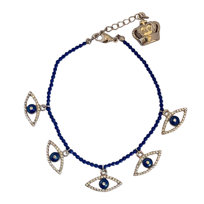 Butler & Wilson crystal eye bracelet with lapis blue beads and crown charm