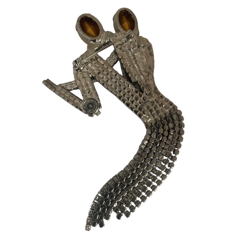 reverse side of vintage Butler & Wilson brooch depicting a dancing couple, adorned with black and clear Swarovski crystals and silver in colour showing Butler & Wilson backstamp in circular cartouche.