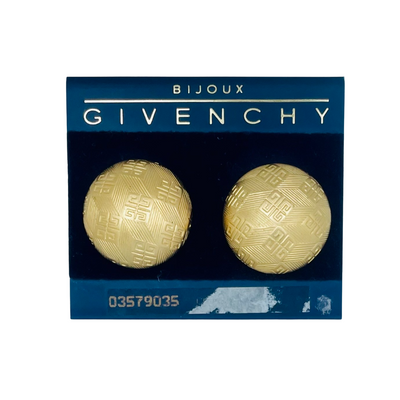 A pair of Vintage Givenchy Button Clip on Earrings