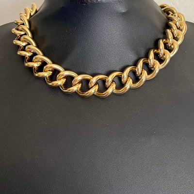 Immaculate 1990s deadstock Alpha Jewels chunky 22ct gold-plated flat curb link chain statement necklace shown on black bust.