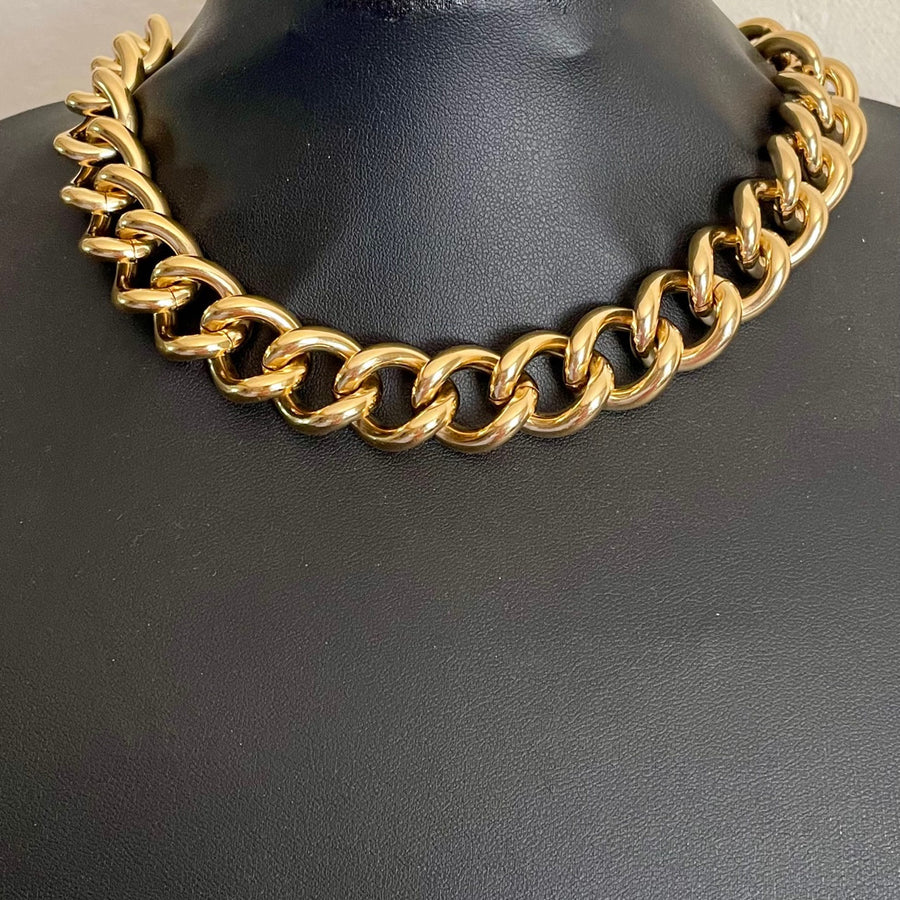 Immaculate 1990s deadstock Alpha Jewels chunky 22ct gold-plated flat curb link chain statement necklace shown on black bust.