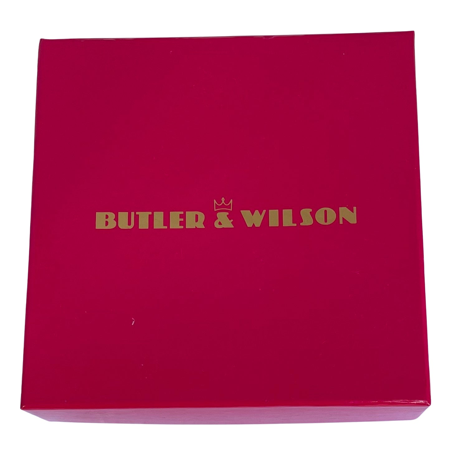 Butler & Wilson pink box housing acolourful Butler & Wilson frog-shaped brooch or pin featuring a gold-tone body and umbrella, covered in green and blue rhinestones, with small red rhinestone eyes, on a plain white background.