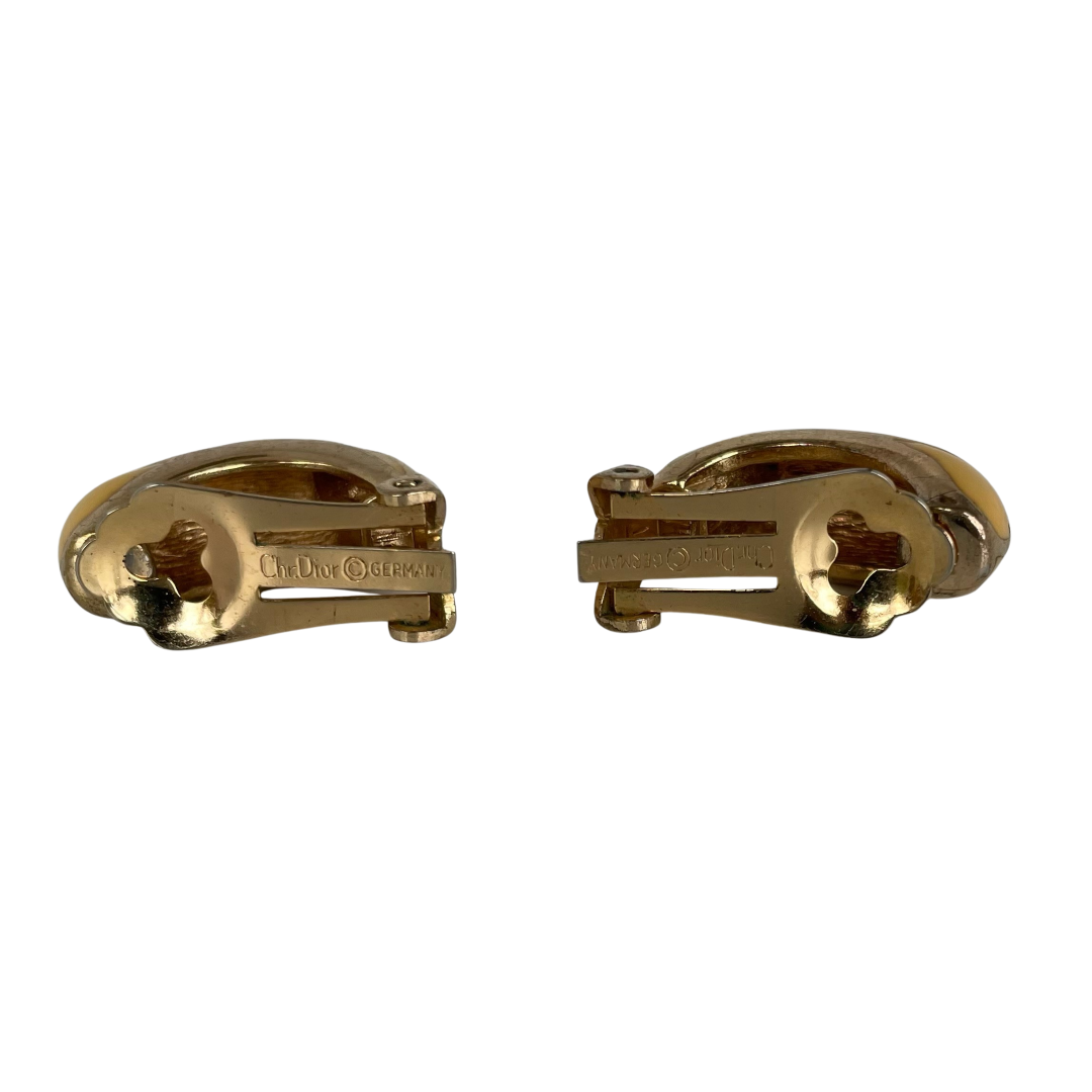 A pair of Vintage Christian Dior Cream Enamel Clip Earrings