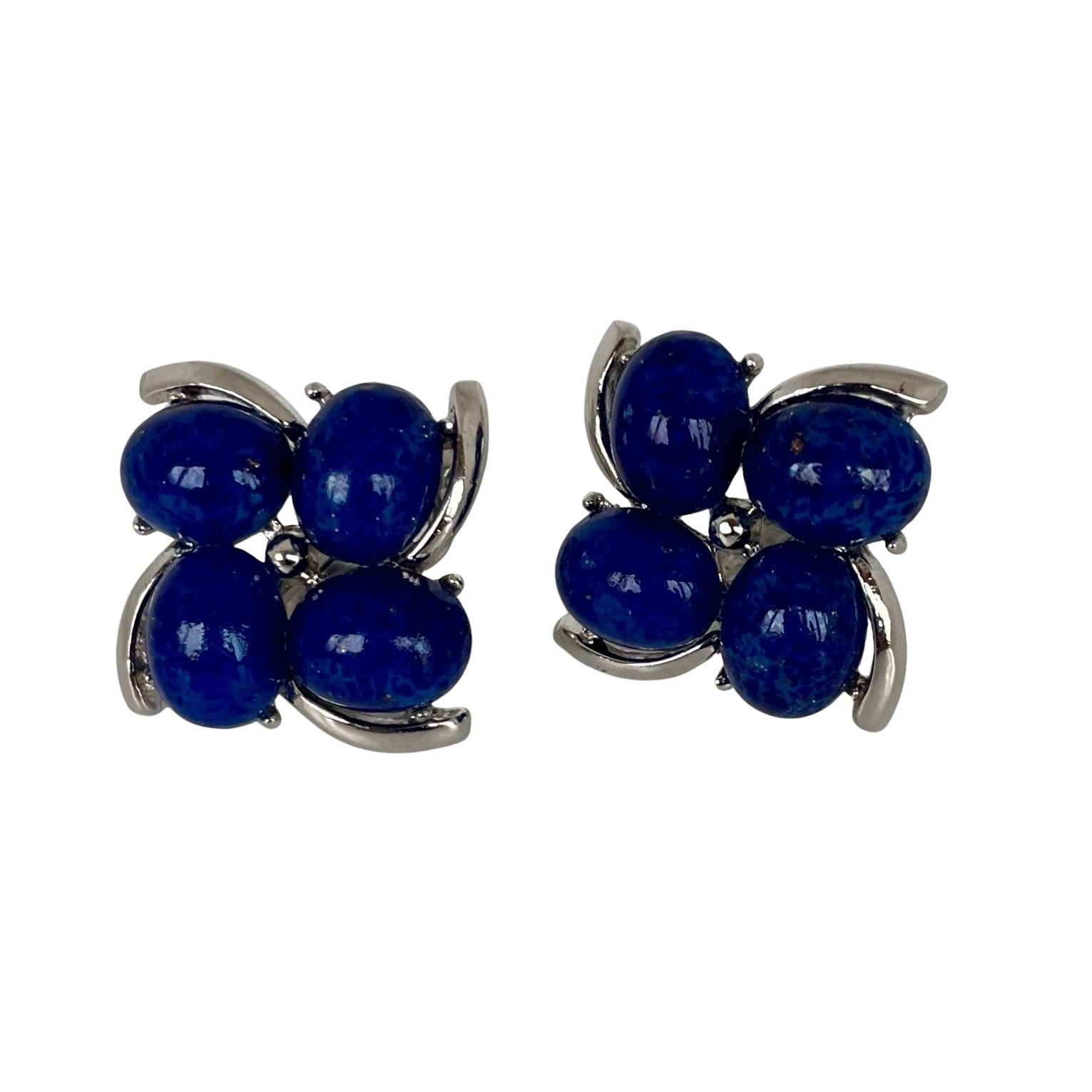 A pair of Mid Century Crown Trifari Lucite Clip On Earrings