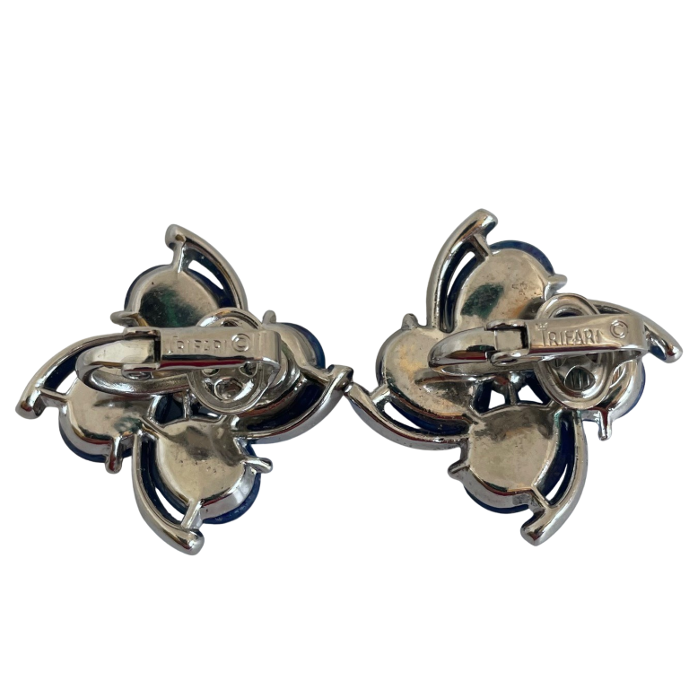 A pair of Mid Century Crown Trifari Lucite Clip On Earrings
