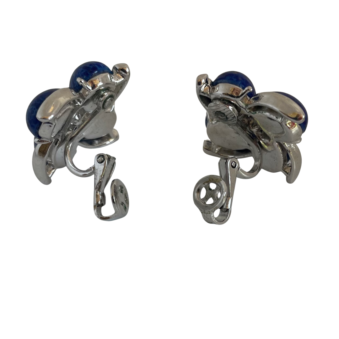 A pair of Mid Century Crown Trifari Lucite Clip On Earrings