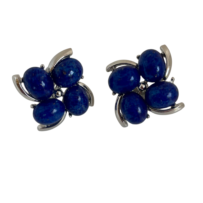 A pair of Mid Century Crown Trifari Lucite Clip On Earrings