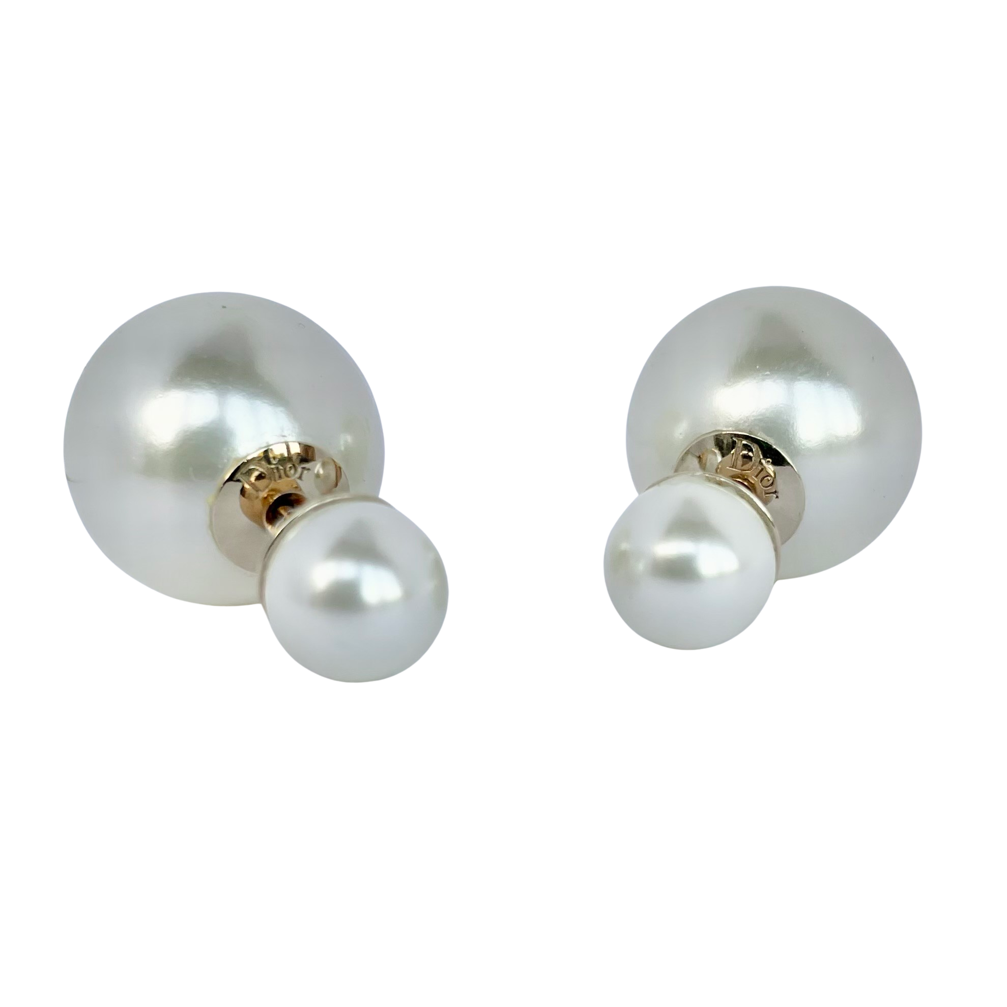 Dior Tribales stud earrings in excellent condition, featuring classic double-sided white resin pearls and gold-finish signature hardware.