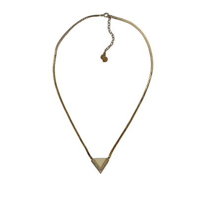 Gold-plated Art Deco style Christian Dior geometric triangle necklace with cream enamel and clear crystal accents on a white background.